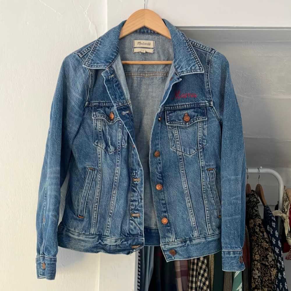 Madewell classic denim jacket. Embroidered in red thread says “mama”